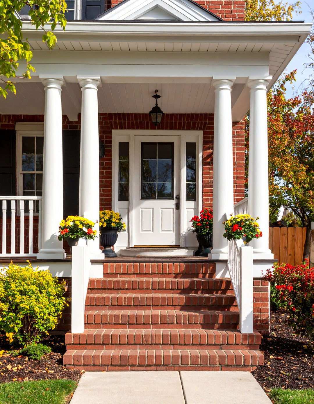 Colonial Style Columns and Railings - 24 Raised Ranch Front Porch Ideas