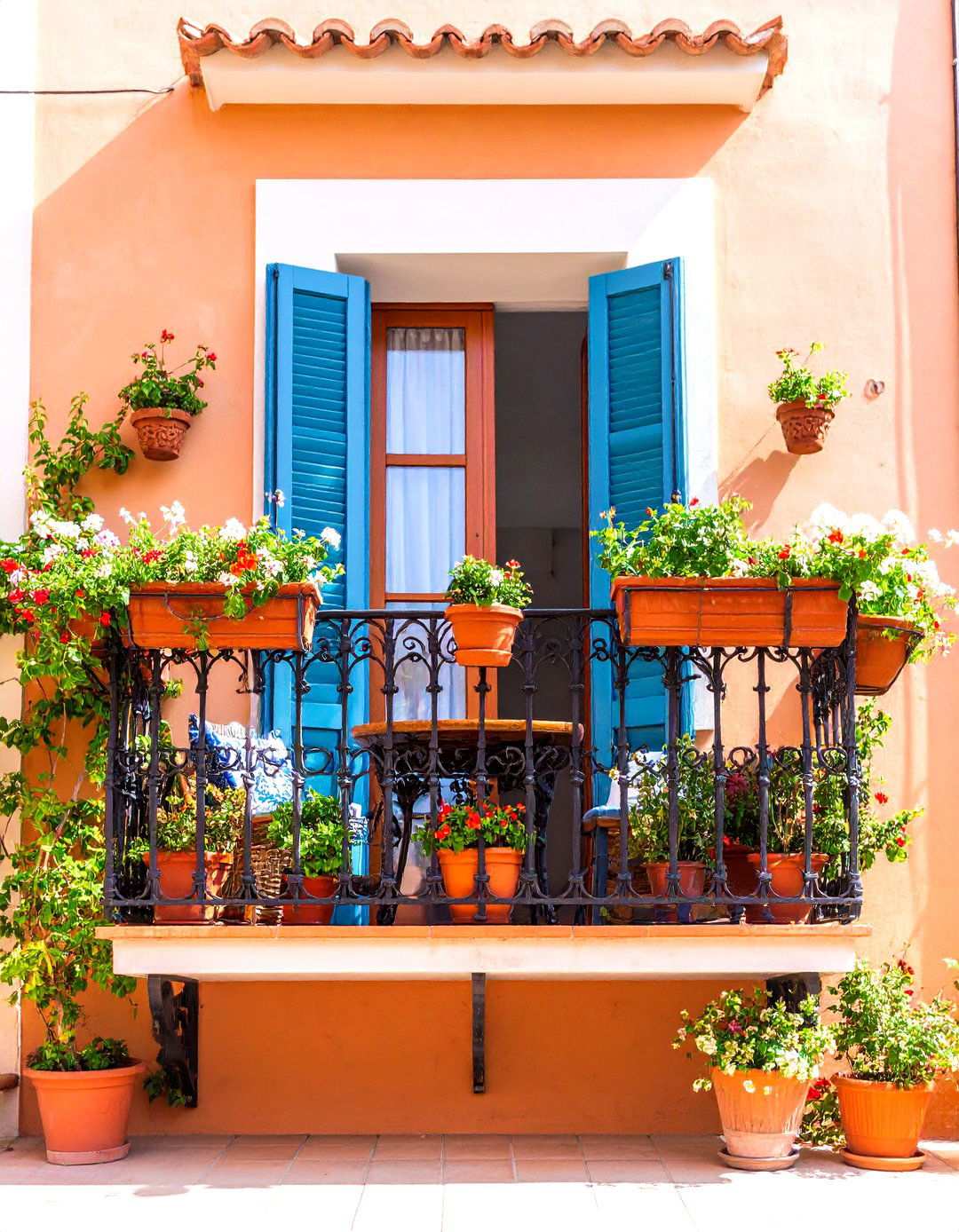 Mediterranean Terracotta Balcony with Wrought Iron Details - 24 Second Story Balcony Ideas