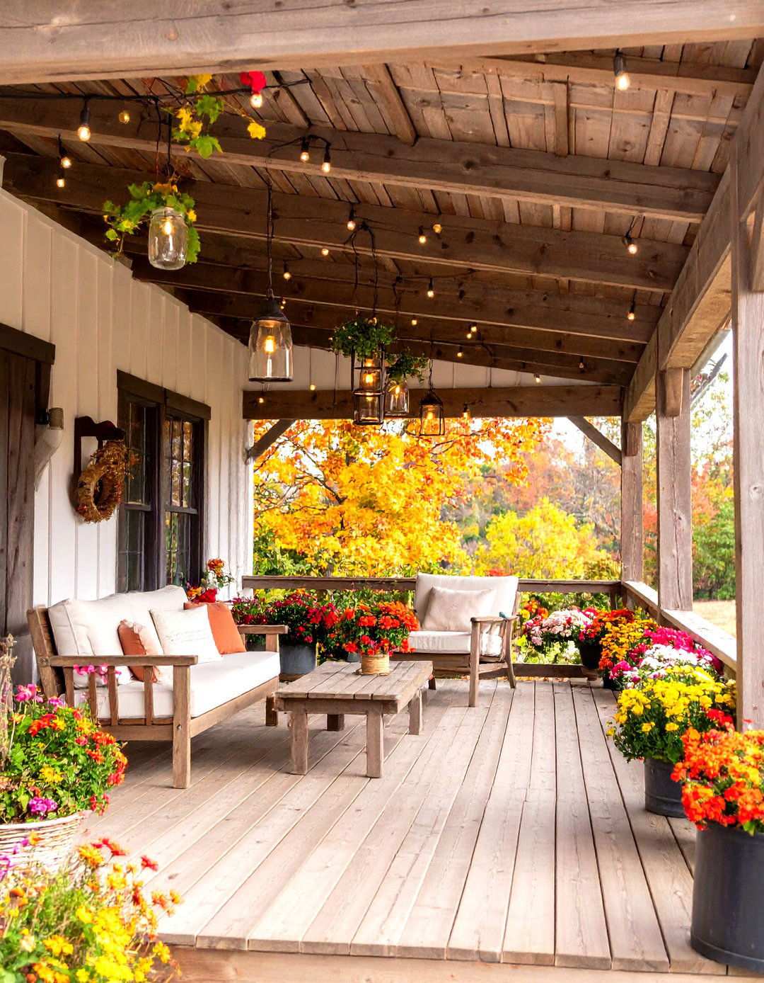Rustic Farmhouse Veranda with Reclaimed Wood - 24 Veranda Ideas